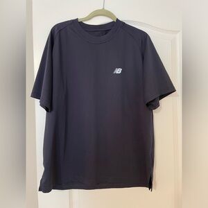 New balance men’s sport shirt. Nave blue size large. Worn once. 100% polyester
